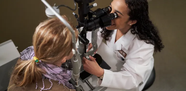 Ophthalmologist Dana Wallace performs an eye exam