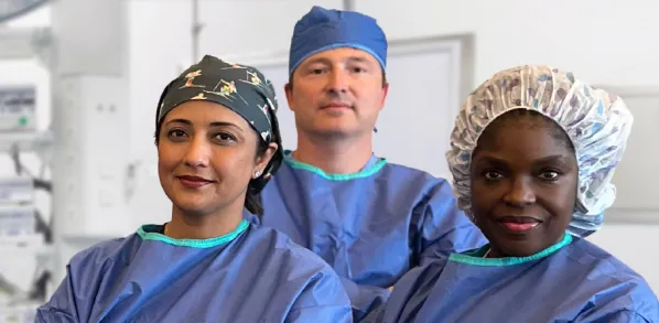 Three ophthalmologist eye surgeons in an operating room