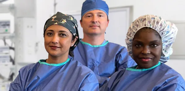 Three ophthalmologist eye surgeons in an operating room