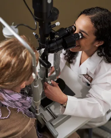 Ophthalmologist Dana Wallace performs an eye exam
