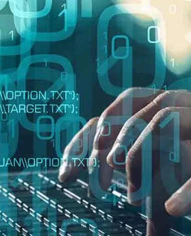 Hands typing on a keyboard overlaid with computer code