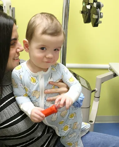 Pediatric ophthalmologist David Ramirez, MD, examines a young patient