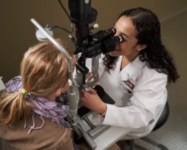 Ophthalmologist Dana Wallace performs an eye exam