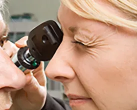 An ophthalmologist examines a patient's eye
