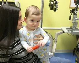 Pediatric ophthalmologist David Ramirez, MD, examines a young patient