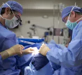 Ophthalmologist and assistant performing eye surgery